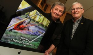 Greg Sprague, left, a member of the Miramichi Salmon Association board, and David Wilson, right, chairman of the board, are encouraging people to get the new fundraising calendar and help support the important work being done by the association.  Photo: Stephen MacGillivray/The Daily Gleaner  