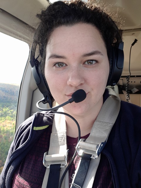 MSA Biologist Kelsey McGee in Helicopter looking for beaver dams 2017